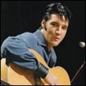 A person holding a guitar

Description automatically generated