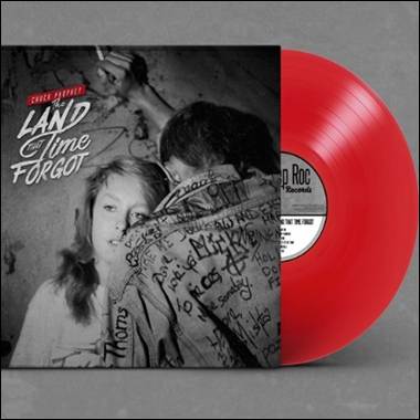 A red vinyl record with a cover

Description automatically generated