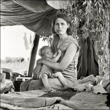 A person holding a baby

Description automatically generated