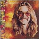 A person with long hair and mustache wearing sunglasses

Description automatically generated