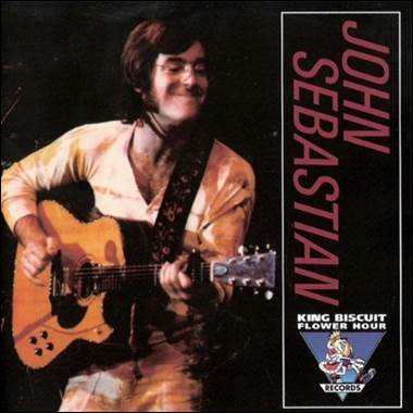 A person playing guitar and smiling

Description automatically generated