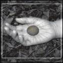 A hand holding a stone

Description automatically generated