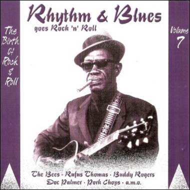 A person with a cigar and a guitar

Description automatically generated