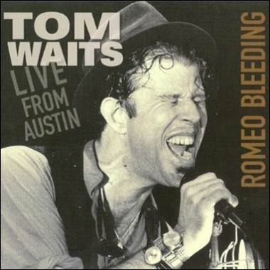 A person singing into a microphone

Description automatically generated