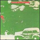 A green and white cover with a car and a person in the background

Description automatically generated