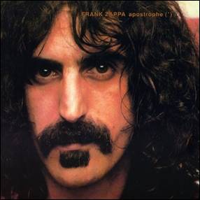 A person with long curly hair and a mustache
Description automatically generated