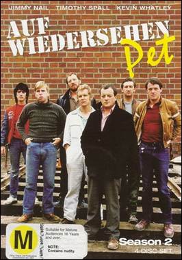 A group of men standing in front of a brick wall
Description automatically generated