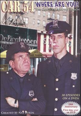 A couple of police officers in front of a building
Description automatically generated