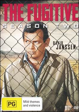 A person in a brown jacket behind a fence
Description automatically generated