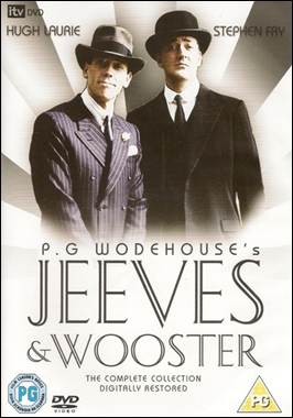 A person in suit and tie standing next to another person in suit
Description automatically generated