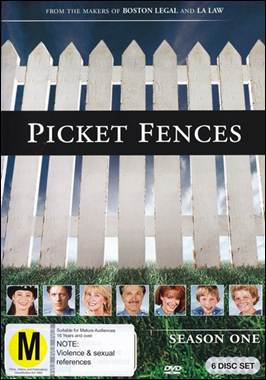 A white fence with several pictures of people
Description automatically generated