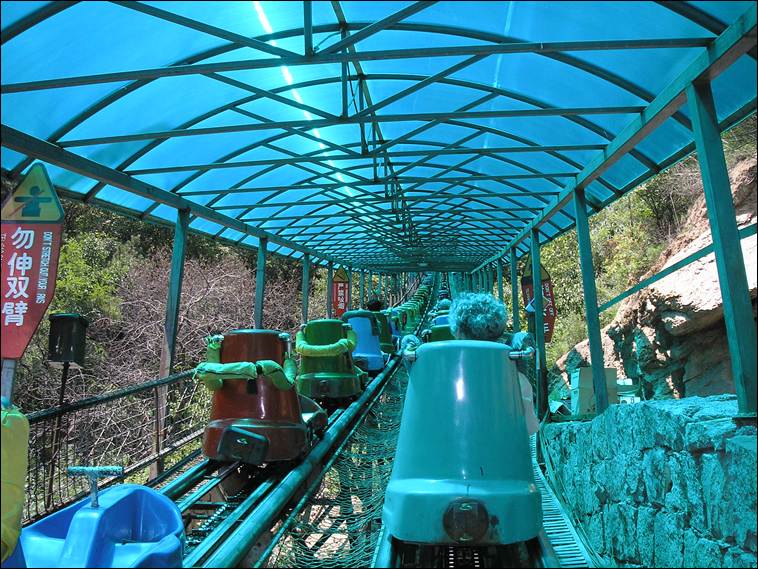 A roller coaster ride with blue cover

AI-generated content may be incorrect.