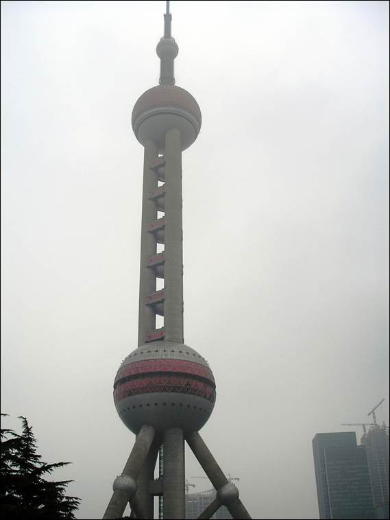 A tall tower with a pointy top with Oriental Pearl Tower in the background

AI-generated content may be incorrect.