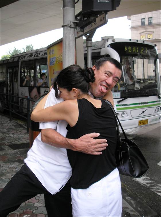A person and person hugging at a bus stop

AI-generated content may be incorrect.