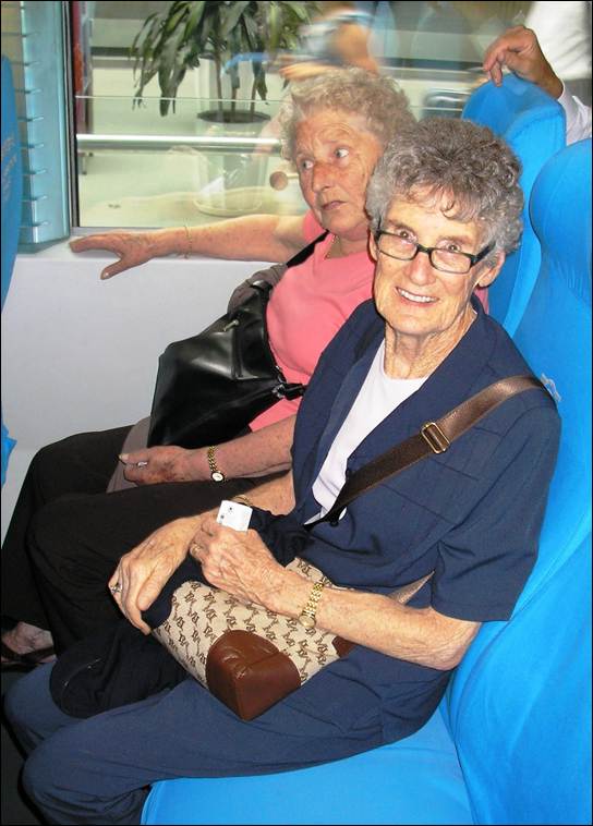 A couple of elderly women sitting on a bus

AI-generated content may be incorrect.