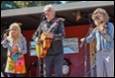 A group of people playing instruments

Description automatically generated with medium confidence