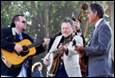 A group of men playing instruments

Description automatically generated with medium confidence
