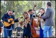 A group of people playing instruments

Description automatically generated
