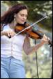 A person playing a violin

Description automatically generated