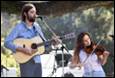 A person and person playing instruments

Description automatically generated with medium confidence