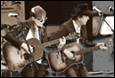 A group of people playing guitars

Description automatically generated with medium confidence