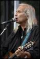 A person with long hair singing into a microphone

Description automatically generated with medium confidence