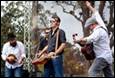 A group of men playing instruments on stage

Description automatically generated with medium confidence