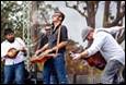 A group of men playing instruments

Description automatically generated with medium confidence
