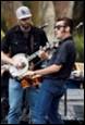 A picture containing person, clothing, musical instrument, guitar

Description automatically generated