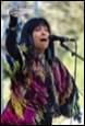 A person singing into a microphone

Description automatically generated