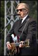 A person playing a guitar

Description automatically generated with medium confidence