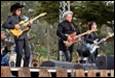 A group of people playing instruments

Description automatically generated