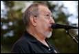 A person with a microphone in his mouth

Description automatically generated with medium confidence