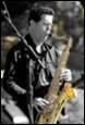 A person playing a saxophone

Description automatically generated with medium confidence