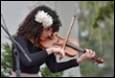 A person playing a violin

Description automatically generated