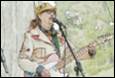 A person playing a guitar

Description automatically generated