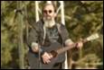 A person playing a guitar

Description automatically generated