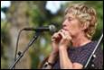 A person singing into a microphone

Description automatically generated