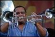 A person playing a trumpet

Description automatically generated with medium confidence