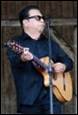 A person playing a guitar

Description automatically generated with medium confidence