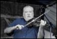 A person playing a violin

Description automatically generated