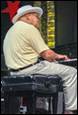 A person wearing a santa hat playing a piano

Description automatically generated with medium confidence