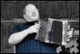 A person playing an accordion

Description automatically generated with medium confidence