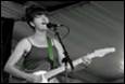 A person singing into a microphone

Description automatically generated with medium confidence