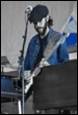 A person playing a guitar

Description automatically generated with medium confidence