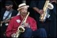 A person playing a saxophone

Description automatically generated with medium confidence