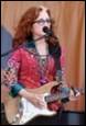A person singing into a microphone

Description automatically generated with medium confidence