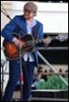 A person playing a guitar

Description automatically generated with medium confidence