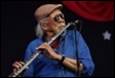 A person playing a flute

Description automatically generated