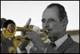 A person playing a trumpet

Description automatically generated with medium confidence